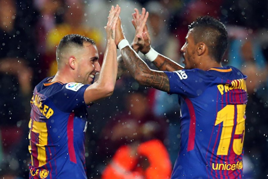 Alcacer revival helps Barca sink Sevilla