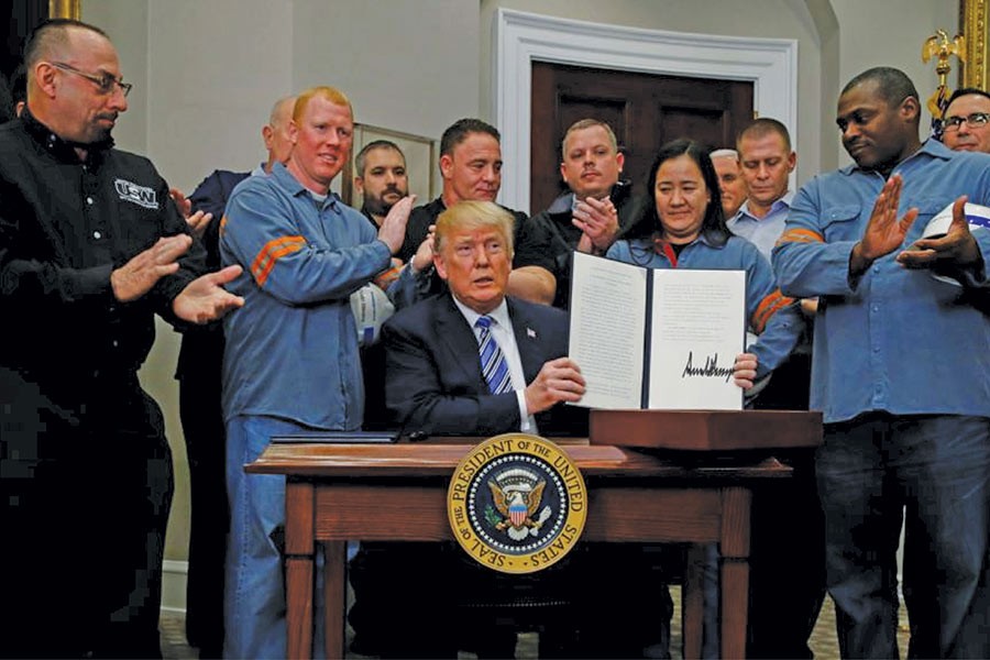 President Trump after signing an order imposing sweeping new tariffs on imported steel and aluminum at the White House on March 08, 2018. —Photo: Reuters