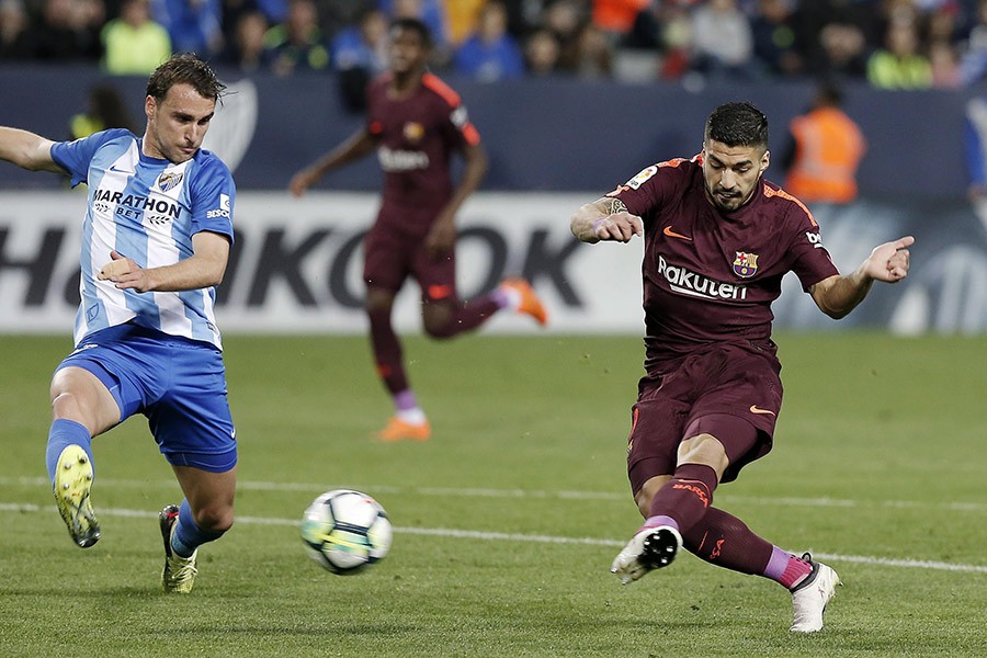 Messi-less Barca ease past Malaga