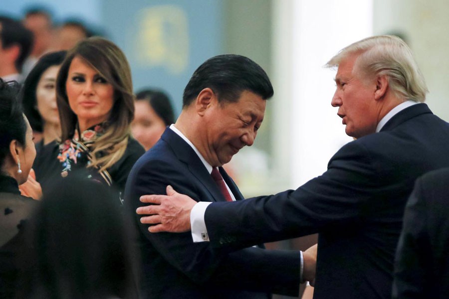 China's President Xi Jinping, first lady Peng Liyuan, US President Donald Trump and first lady Melania attending a state dinner at the Great Hall of the People in Beijing, China recently	— Reuters