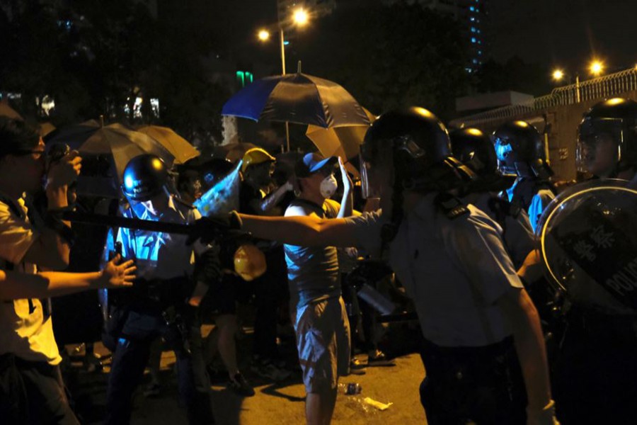 Tensions high as Hong Kong charges 44 activists with rioting