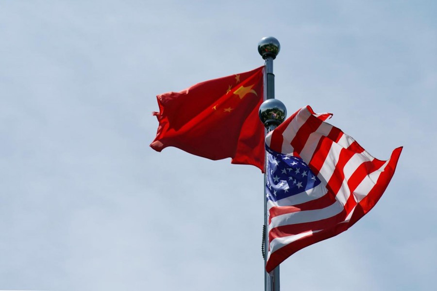 Chinese and US flags flutter near The Bund, before US trade delegation meet their Chinese counterparts for talks in Shanghai, China July 30, 2019. Reuters