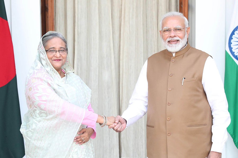 Prime Minister Sheikh Hasina and her Indian counterpart Narendra Modi shaking hands during their meeting at Hyderabad House in New Delhi of India. -Focus Bangla Photo
