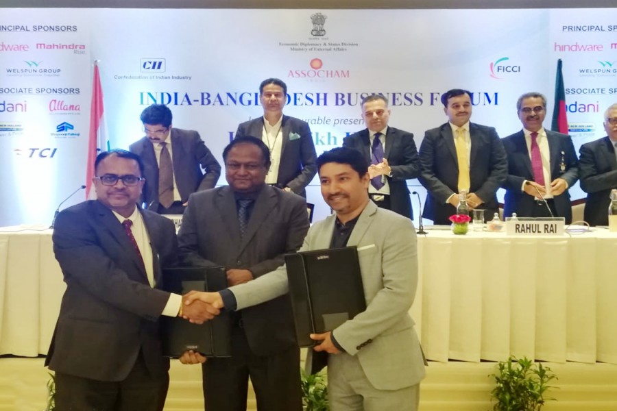 Shameem Ahsan, Chairman, eGeneration Group (1st from right), Tipu Munshi,  Minister, Ministry of Commerce, Government of Bangladesh (middle) and Mangesh Wadaje, CEO of Highbar Technocrat Ltd. (extreme left) seen in the event
