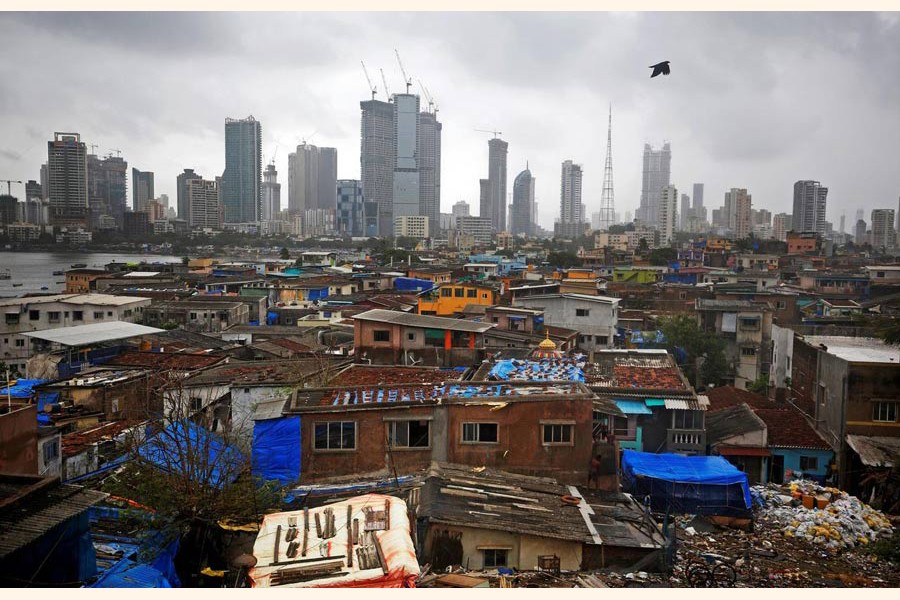 A file photo showing a bird flies across central Mumbai's financial district skyline, India	— Reuters