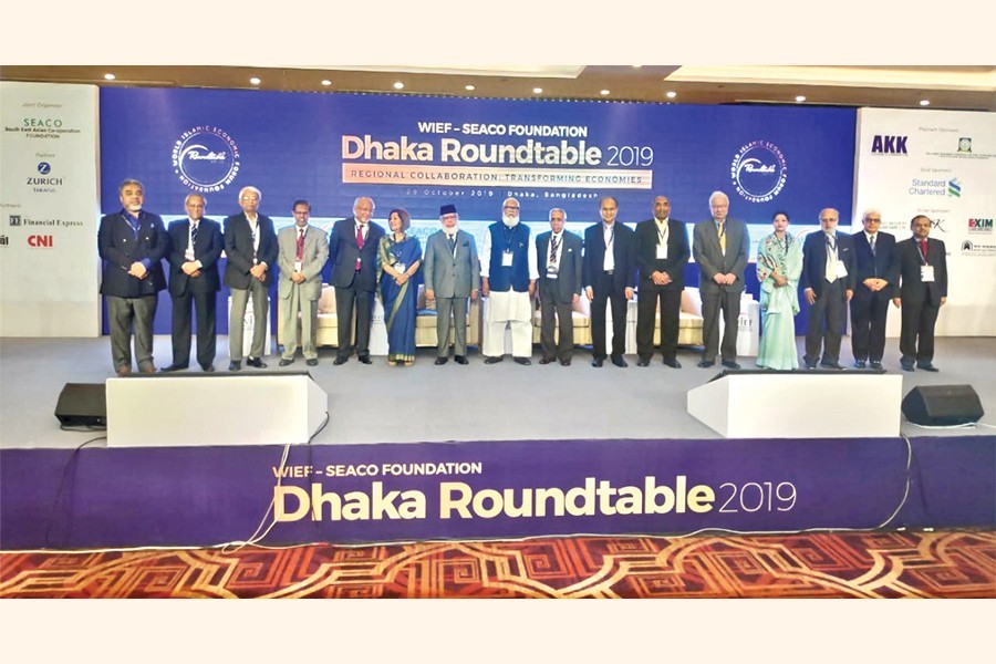 Prime Minister's Private Industries and Investment Adviser Salman F Rahman (8th from L), International Chamber of Commerce, Bangladesh (ICC,B) President Mahbubur Rahman (7th from L) and SEACO Foundation Executive Chairman Salahuddin Kasem Khan (5th from L) posing with others at WIEF-SEACO Foundation Dhaka Roundtable 2019 in the capital on Tuesday
