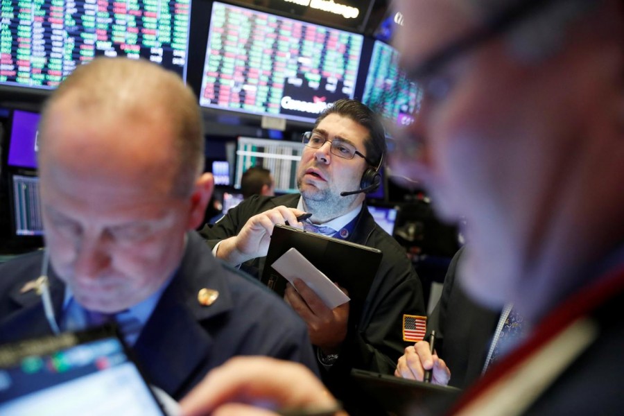 Traders work on the floor of the New York Stock Exchange shortly after the opening bell in New York, US, February 6, 2020. Reuters