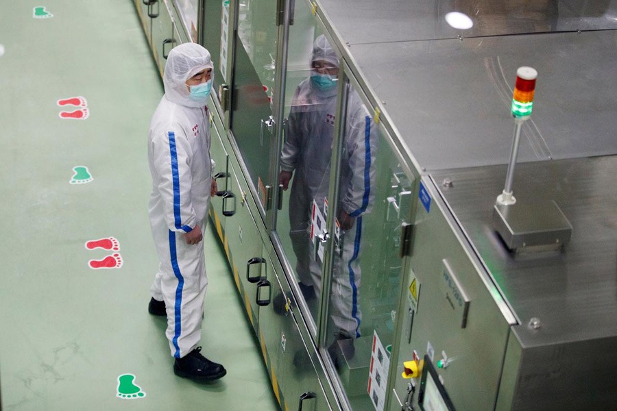 A worker wearing a face mask is seen during a government-organised tour of the Mengniu Dairy factory in Beijing as the country is hit by an outbreak of the novel coronavirus, China, February 27, 2020 — Reuters/Files