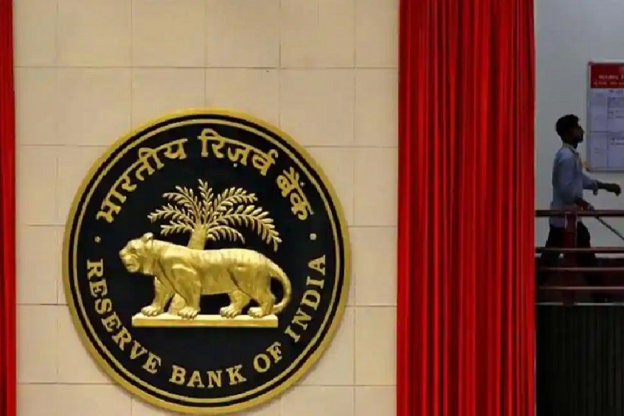 A worker walks past the logo of Reserve Bank of India (RBI) inside its office in New Delhi, India, July 8, 2019. — Reuters/Files