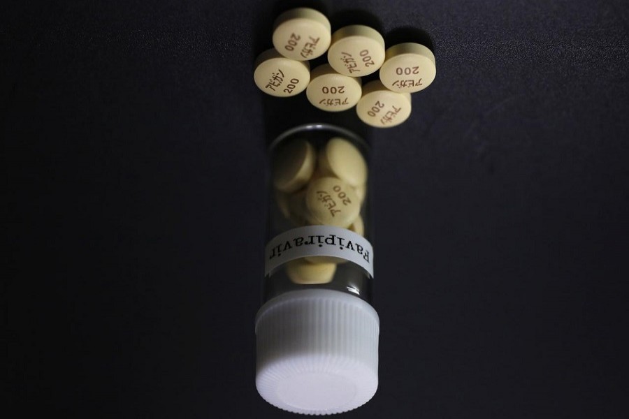 Tablets of Avigan (generic name: Favipiravir), a drug approved as an anti-influenza drug in Japan and developed by drug maker Toyama Chemical Co, a subsidiary of Fujifilm Holdings Co., are displayed during a photo opportunity at Fujifilm's headquarters in Tokyo, October 22, 2014. — Reuters/Files