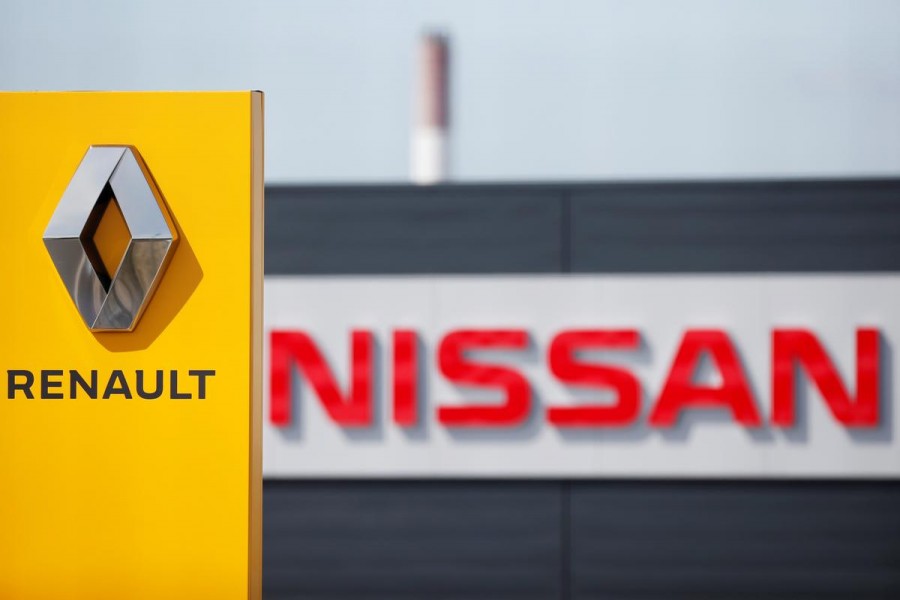 The logos of car manufacturers Renault and Nissan are seen in front of dealerships of the companies in Reims, France on July 9, 2019 — Reuters/Files