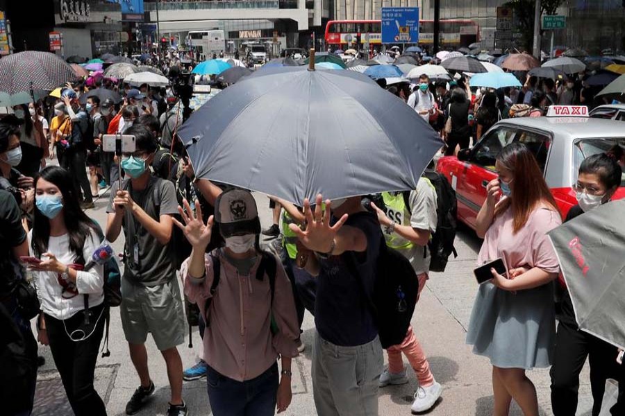 Hong Kong police detain 300 as thousands protest over security laws