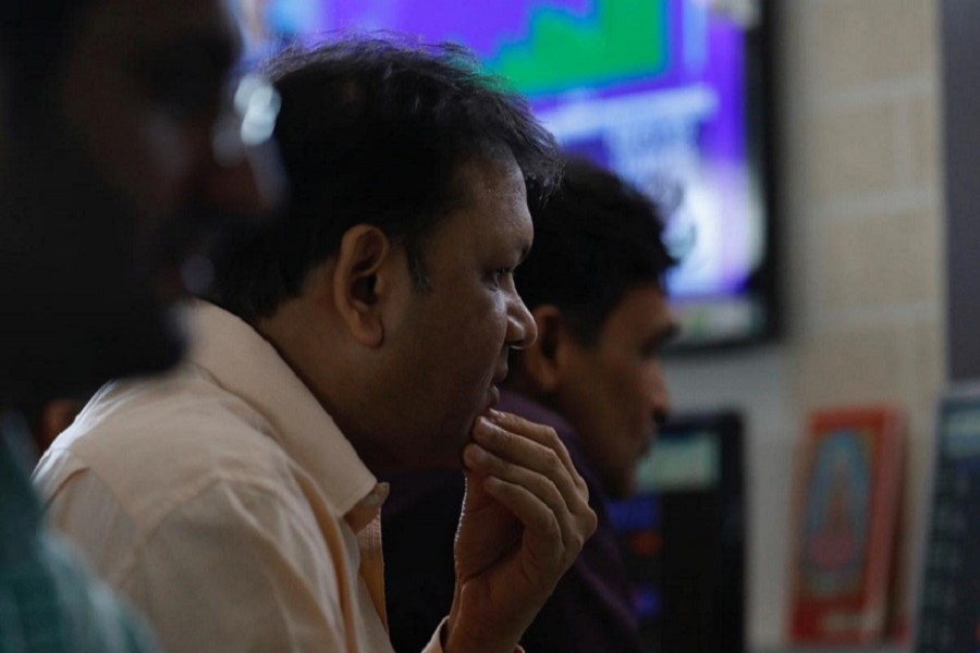 A broker reacts while trading at his computer terminal at a stock brokerage firm in Mumbai, India, December 28, 2017 — Reuters/Files