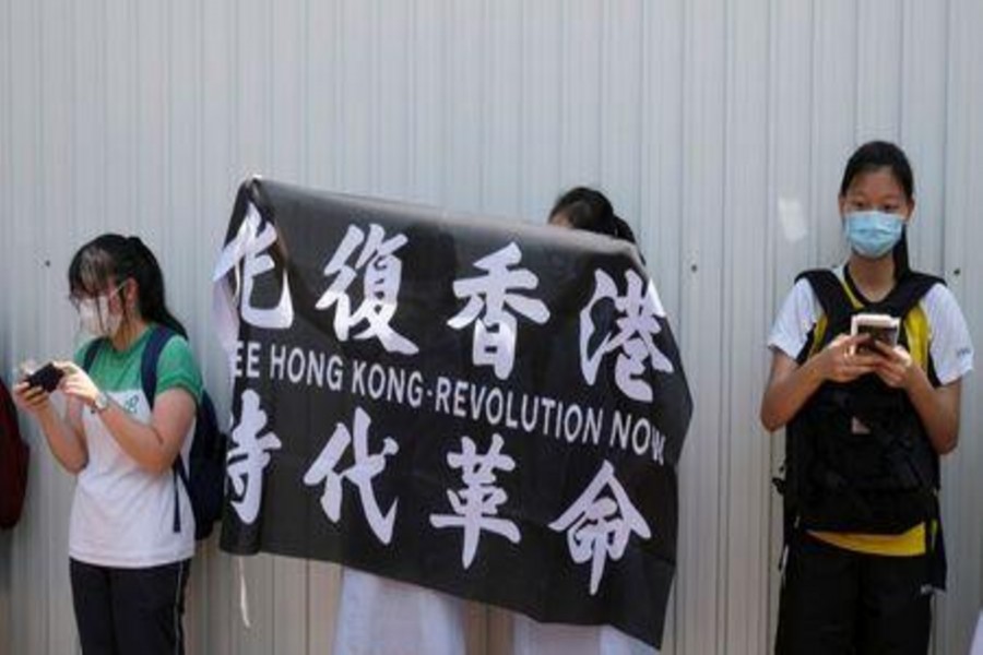 Hong Kong bans protest anthem in schools as fears over freedoms intensify