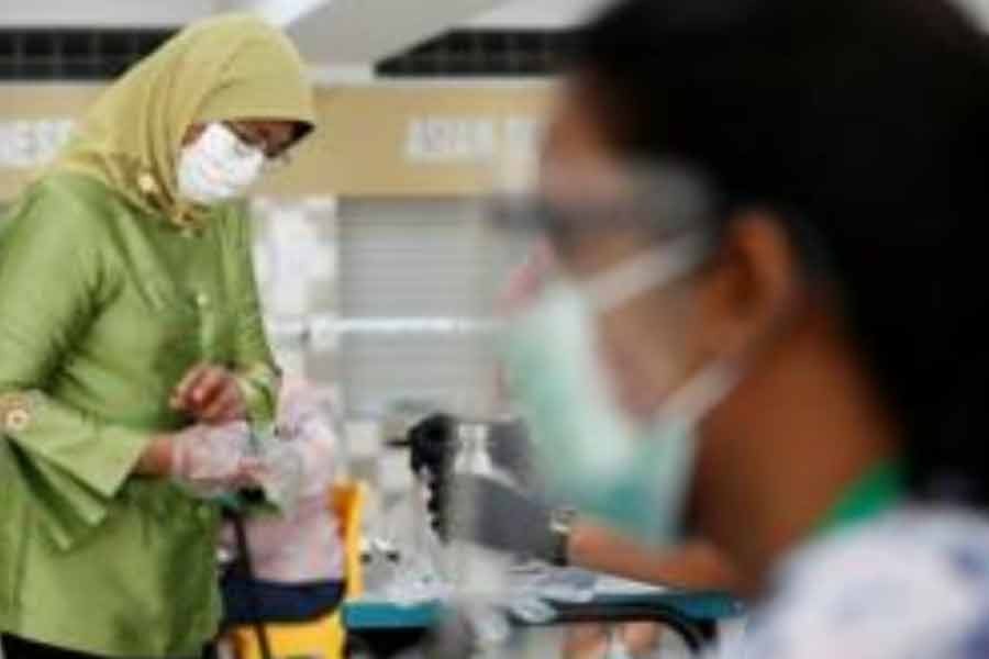 Singapore ruling party wins elections, but support falls