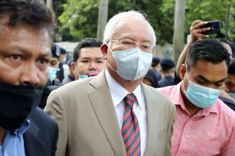 Malaysia's Najib convicted on all charges in first 1MDB trial