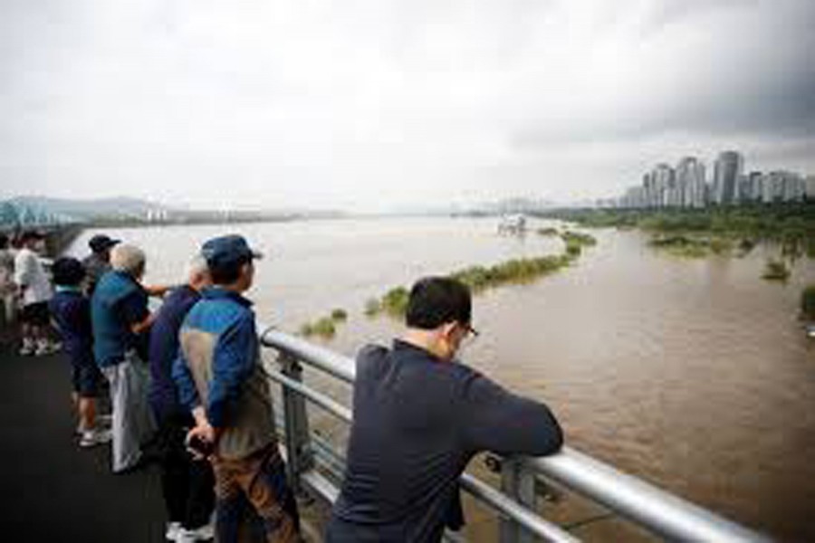 South Korea looks for rescue workers missing in floods