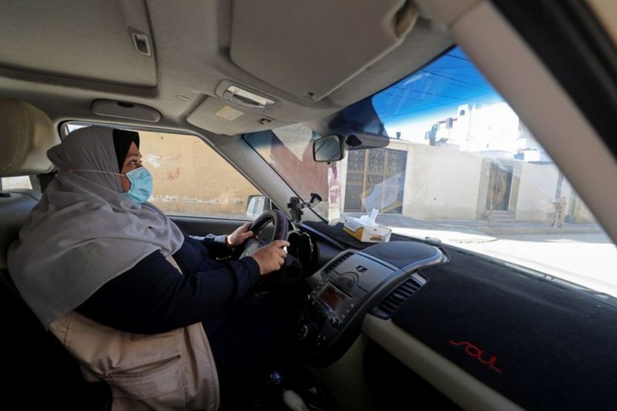 Mother-of-five steers new course as Gaza's first woman taxi driver