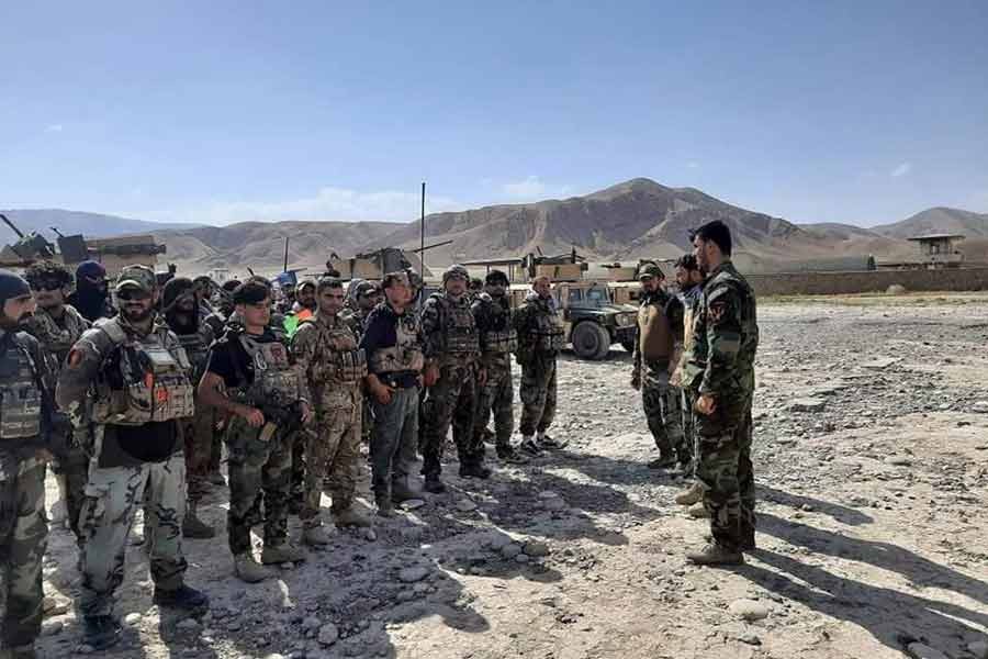 Hundreds of Afghan troops flee into Tajikistan as Taliban advance