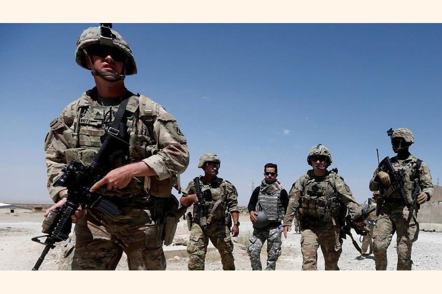 A file photo shows US troops patrol at an Afghan National Army (ANA) Base in Logar province, Afghanistan.         —Reuters photo
