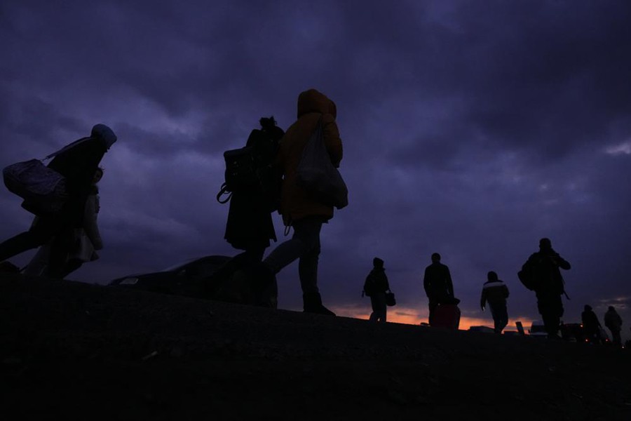 People fleeing conflict in neighboring Ukraine arrive in Poland (AP Photo)