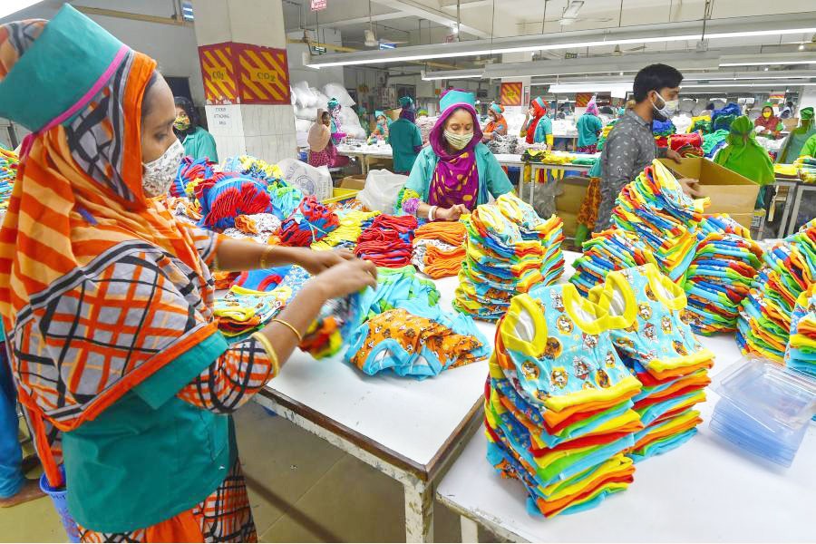 Workers at a ready-made garments factory in Gazipur are passing busy time. 	—Xinhau Photo