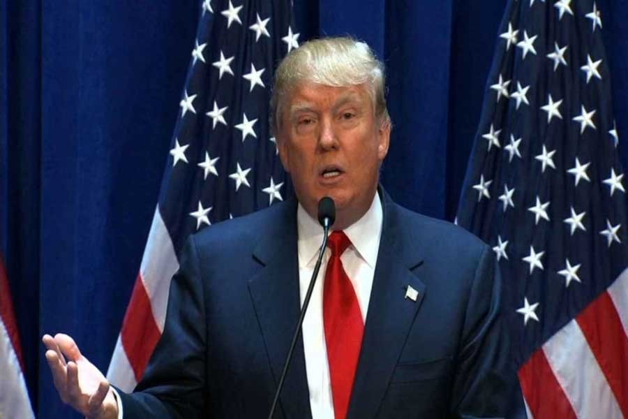 US President Donald Trump speaks to reporters after a security briefing with Vice President Mike Pence (R) at Trump's golf estate in Bedminster, New Jersey US August 10, 2017. Reuters/ File Photo