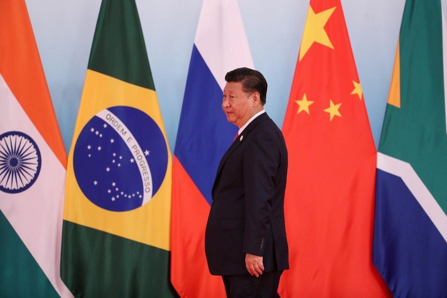 Chinese President Xi Jinping arrives for a group photo during the BRICS Summit at the Xiamen International Conference and Exhibition Centre in Xiamen, southeastern China's Fujian Province, China September 4, 2017. Reuters