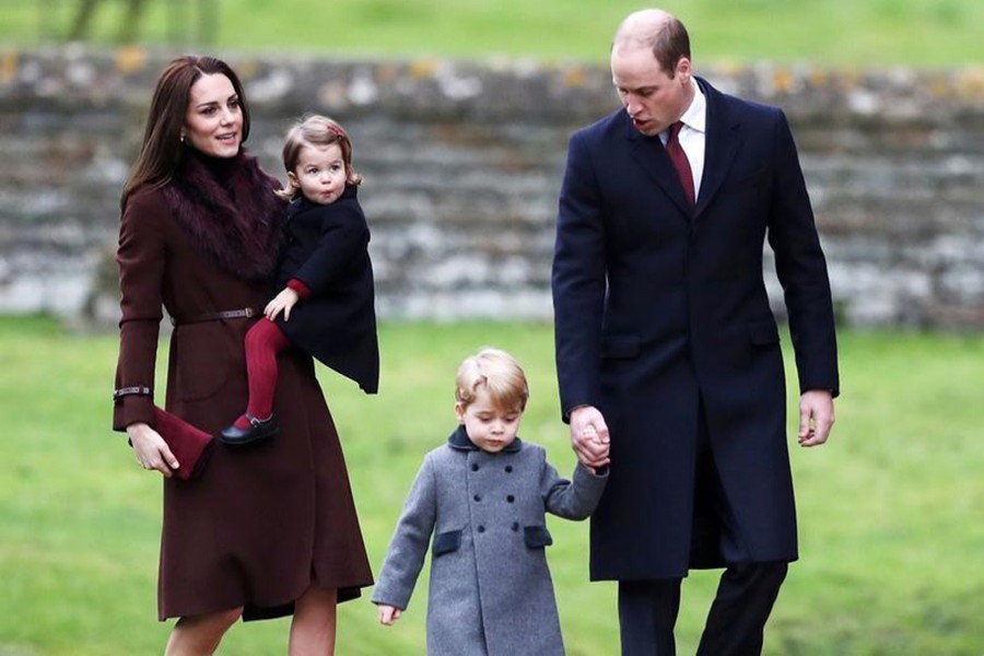 Prince William, the Duke of Cambridge (R), his wife Catherine, The Duchess of Cambridge (L), Prince George (2nd R) and Princess Charlotte are seen in the photograph. - Reuters file photo