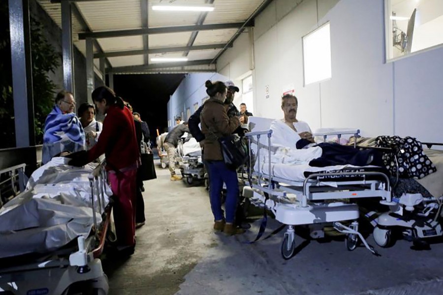 Patients and family members are seen outside the Institute for Social Security and Services for State Workers (ISSSTE) after an earthquake struck off the southern coast of Mexico late on Thursday, in Puebla, Mexico. - Reuters photo