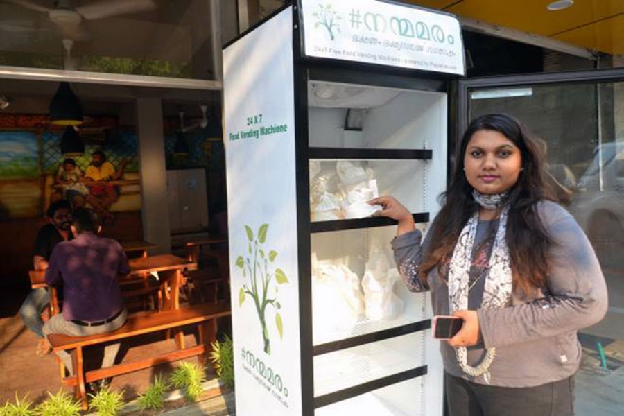 Minu Pauline with the refrigerator in front of her eatery. Photo credit: Thulasi Kakkat /thehindu.com