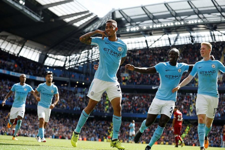 Manchester City's Gabriel Jesus celebrates scoring their second goal with Benjamin Mendy and Kevin De Bruyne. - Reuters photo