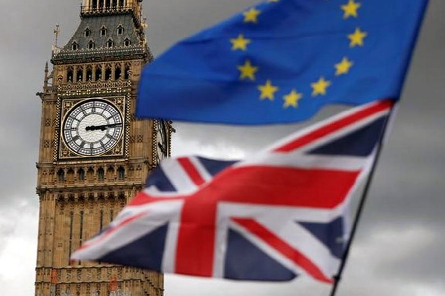 The Union Flag and a European Union flag fly near the Elizabeth Tower - Reuters Photo.