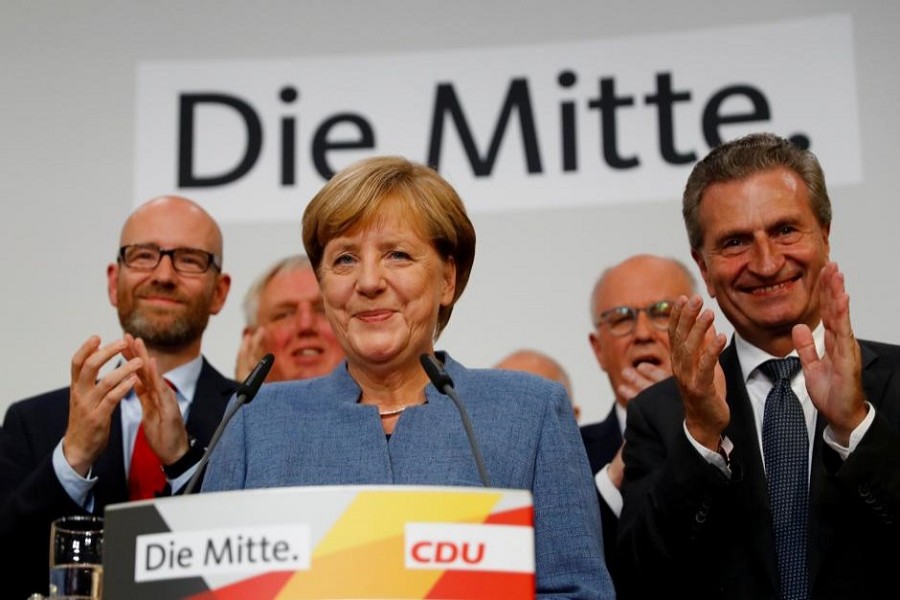 Christian Democratic Union CDU party leader and German Chancellor Angela Merkel reacts after winning the German general election (Bundestagswahl) in Berlin, Germany, Sept 24, 2017. Reuters