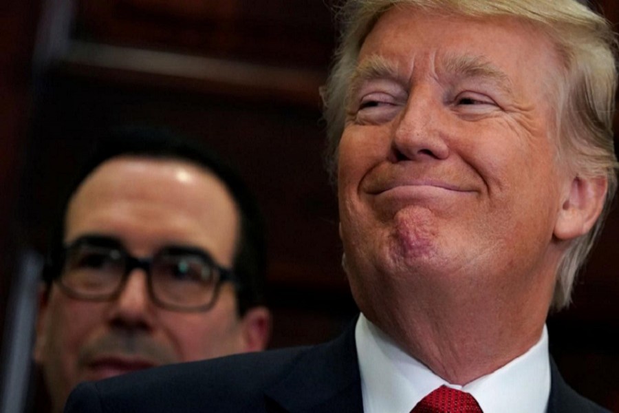 US President Donald Trump is seen smiling in this photo taken at the White House in Washington, October 12, 2017. Reuters