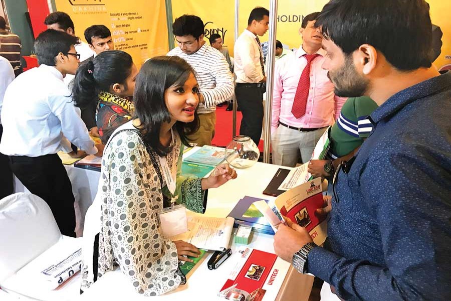 A visitor inquires about housing loan products at a three-day 'Housing Finance Fair-2017,' which began on Thursday in Dhaka. The Bangladesh House Building Finance Corporation is organising the fair.	— FE Photo