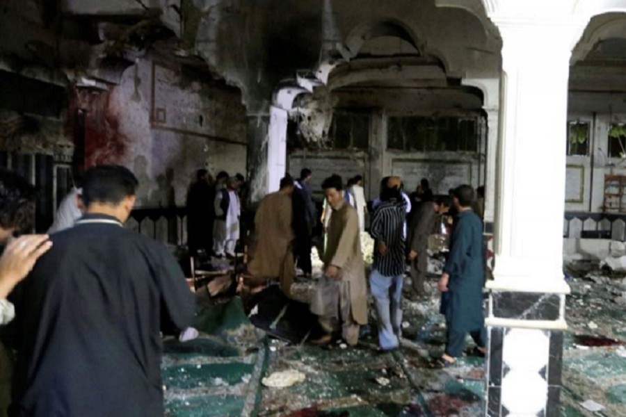 Police and relatives are seen inspecting at the site of a suicide attack in Herat, Afghanistan, Aug. 1, 2017. Reuters/File Photo