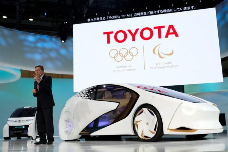 Toyota Motor Corp. Executive Vice President Didier Leroy presents the company's Concept-i series during media preview of the 45th Tokyo Motor Show in Tokyo, Japan on Wednesday. - Reuters