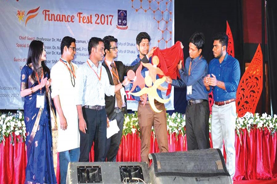 Students unveiling the logo of Finance Fest 2017 at Dhaka University