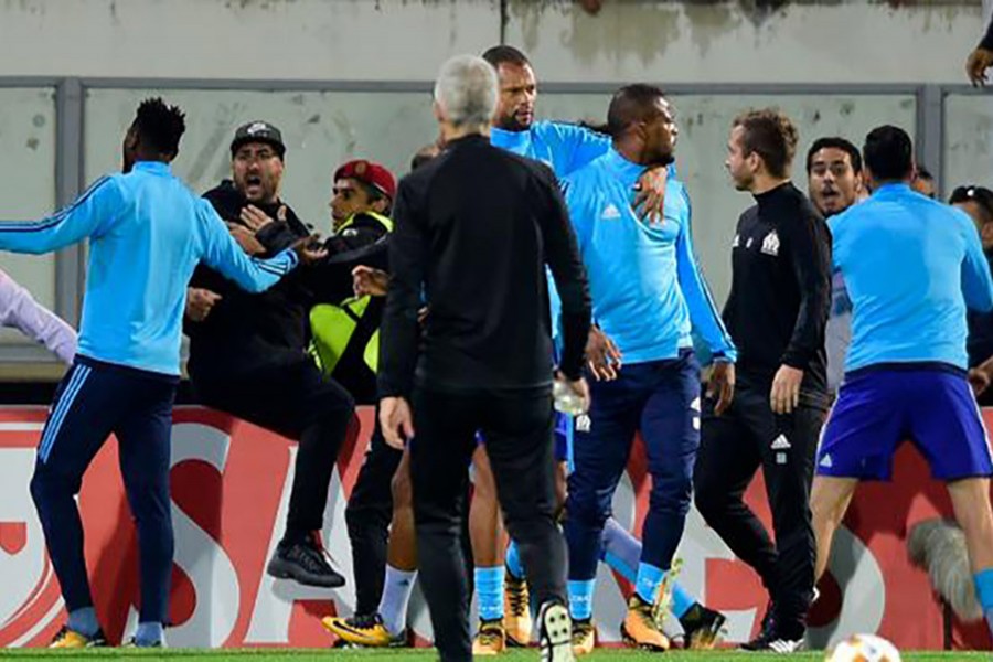 Evra had initially gone over to the fans to talk to them, but the situation had escalated quickly, report says. - BBC