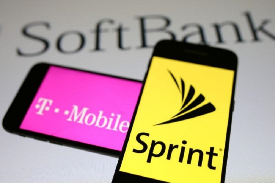 Smartphones with the logos of T-Mobile and Sprint are seen in front of a Soft Bank logo in this illustration taken September 19, 2017. Reuters