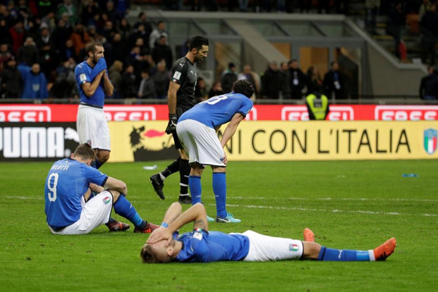 Italy players cut dejected figures after the match as they failed to qualify for the World Cup for the first time in 60 years. - Reuters photo