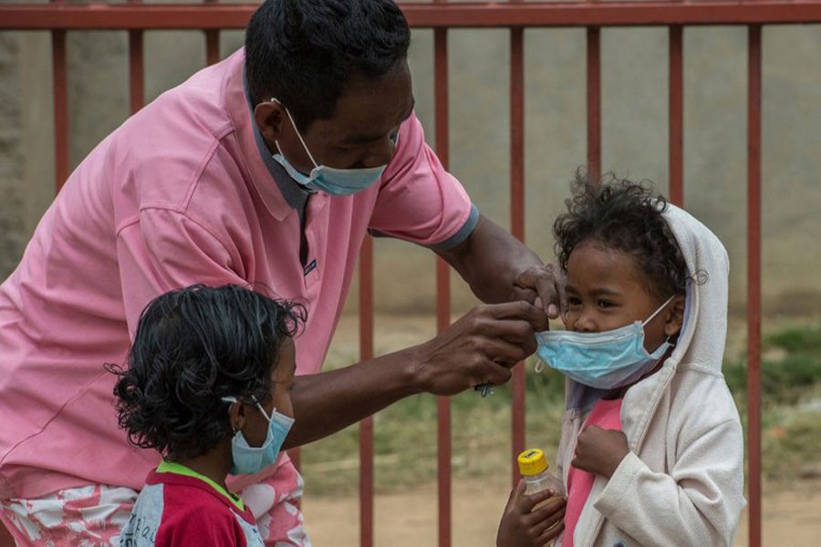 In this file photo, face masks were placed on children in Antananarivo, Madagascar.  An outbreak of plague has killed at least 33 people.  - AP photo