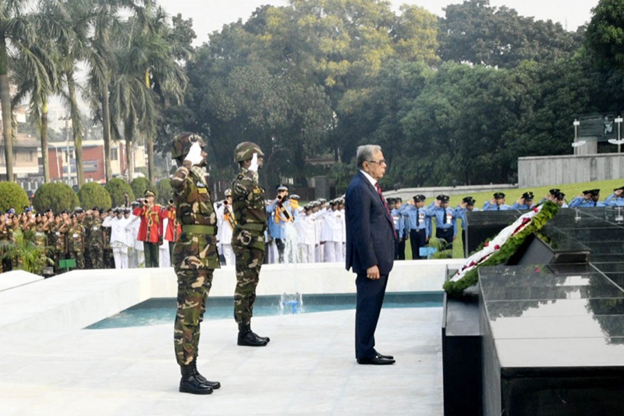 President Abdul Hamid offers his respects to the martyrs by laying wreath at Shikha Anirban at Dhaka Cantonment. - Focus Bangla photo