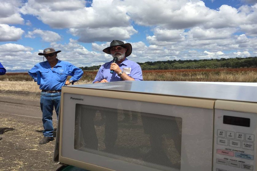 Dr Graham  Brodie (right) demonstes the effects of everyday microwave technology on weed plants during last week's field day.