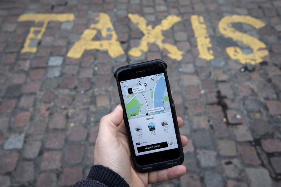 A photo illustration shows the Uber app on a mobile telephone, as it is held up for a posed photograph, in London, Britain November 10, 2017.  Reuters