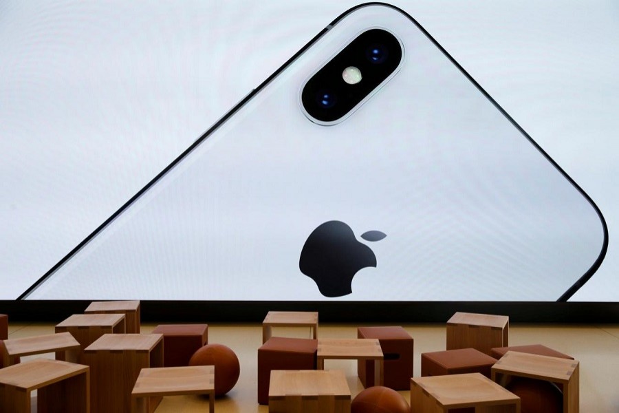 An iPhone X is seen on a large video screen in the new Apple Visitor Center in Cupertino, California, US, November 17, 2017. Reuters/File Photo