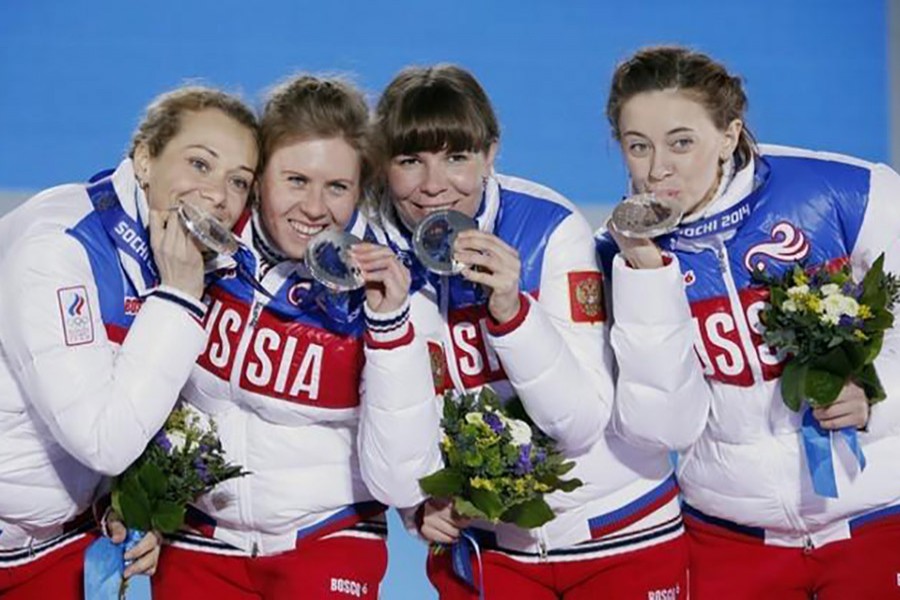 Silver medalists Russia's Olga Zaitseva, Yana Romanova, Ekaterina Shumilova and Olga Vilukhina (L-R) pose on the podium. -Reuters file photo