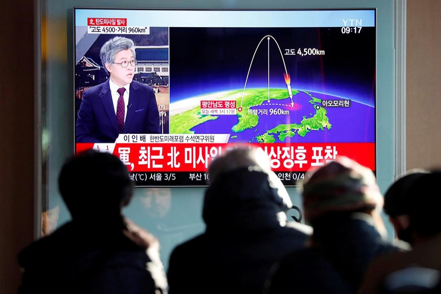 People watch a television broadcast of a news report on North Korea firing what appeared to be an intercontinental ballistic missile (ICBM) that landed close to Japan, in Seoul, South Korea on Wednesday. - Reuters photo