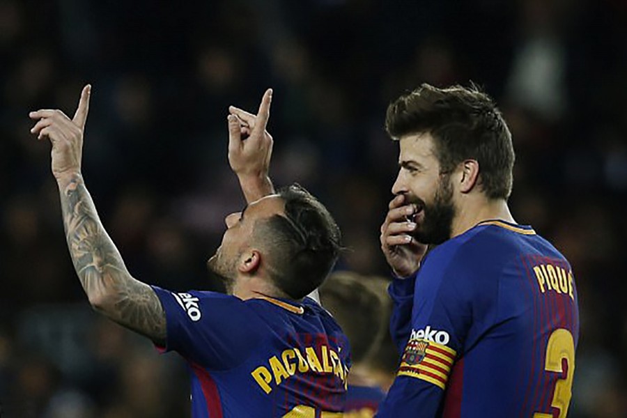 Barcelona striker Paco Alcacer (left) celebrates after scoring against Murcia. - AP photo